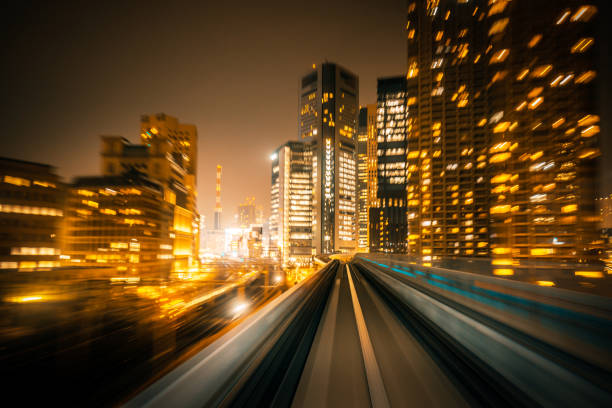 View of motion blurred high speed train speeding over the monorail at night Speed - Train in Tokyo, Japanmotion blur, Long Time Exposure