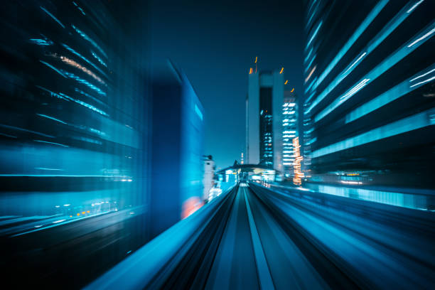 istock train speeding over the monorail at night 1427964870