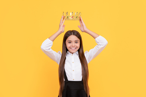 happy selfish teen girl in school uniform wear princess crown, selfishness.