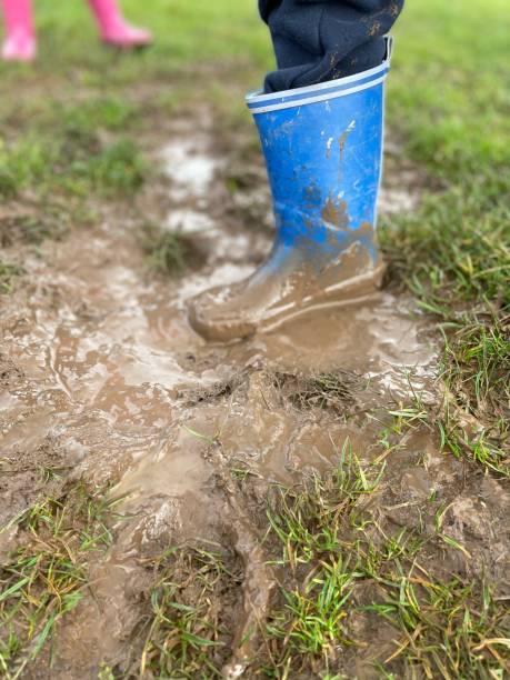istock Children playing in the mud 1427965870