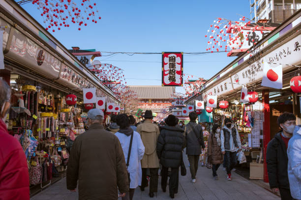 People walking on Nakamise-dori Shopping Street with new year decoration in Asakusa, Tokyo stock photo