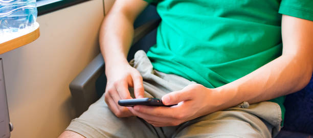 istock young man with cell phone in hand 1427966978