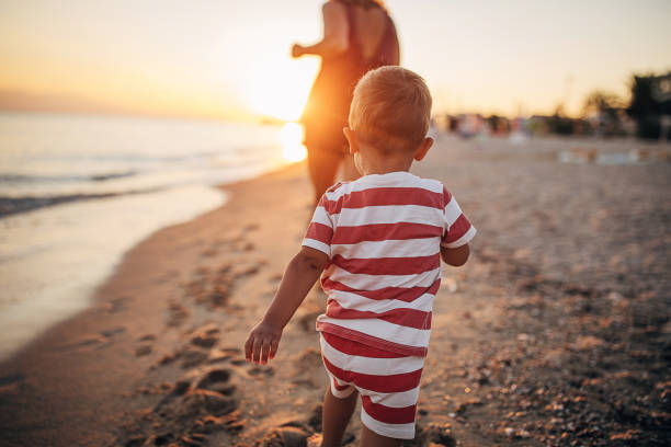 istock A child walking on the beach 1427967071