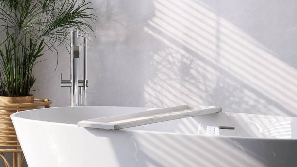 istock White ceramic bathtub and marble bathtub tray in bathroom with sunlight on marble wall 1427967464
