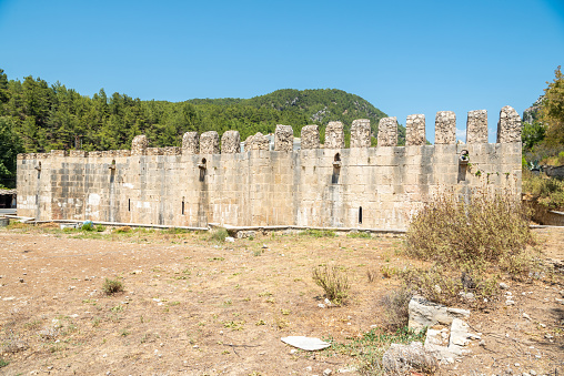 Historic Alara han, a 13th-century caravanserai inn near Alanya, Turkey. The building dates from 1231. Exterior view in summer.