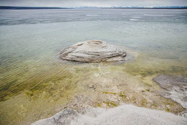 Photo of West Thumb Geyser Basin in Yellowstone with view on the lake