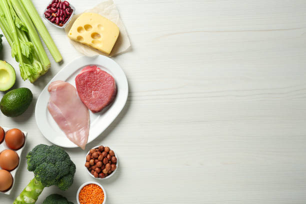 Different fresh products on white wooden table, flat lay and space for text. Sources of essential amino acids Different fresh products on white wooden table, flat lay and space for text. Sources of essential amino acids lysine stock pictures, royalty-free photos & images