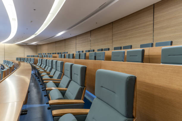 istock Tables and chairs in neatly arranged network video conference room 1427969393