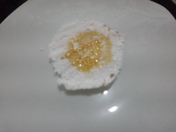 istock Tapioca with sugar syrup, a Brazilian dessert. Close-up shot. 1427969450