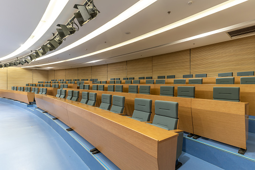 Neatly arranged conference room tables and chairs