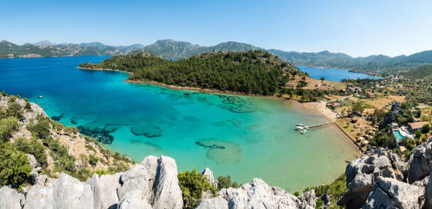 Sig Limani harbor and beach in Selimiye village near Marmaris town in Mugla, Turkey. Sig Limani harbor and beach in Selimiye village near Marmaris resort town in Mugla province of Turkey. marmaris stock pictures, royalty-free photos & images