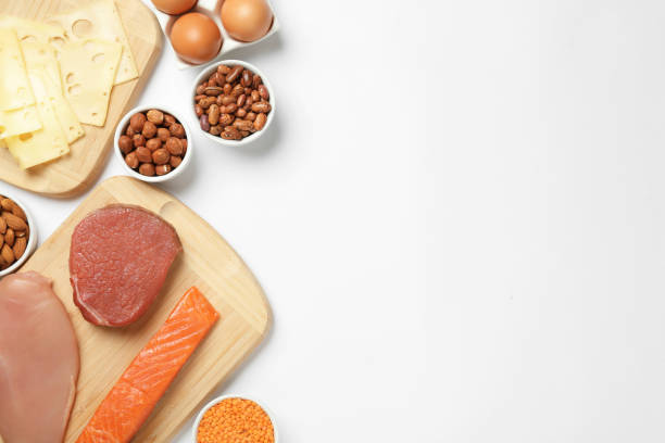 istock Different fresh products on white background, top view. Sources of essential amino acids 1427974228