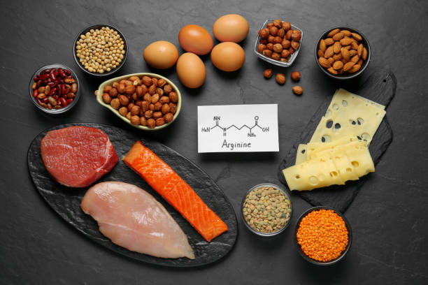 Different fresh products and paper with Arginine chemical formula on black table, flat lay. Sources of essential amino acids Different fresh products and paper with Arginine chemical formula on black table, flat lay. Sources of essential amino acids lysine stock pictures, royalty-free photos & images