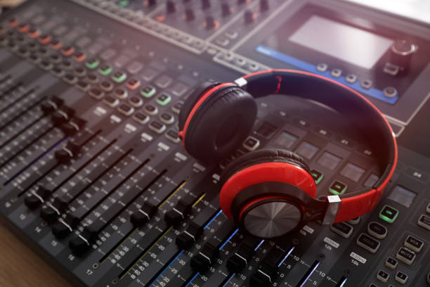 istock Headphones on professional mixing console in modern radio studio 1427974605