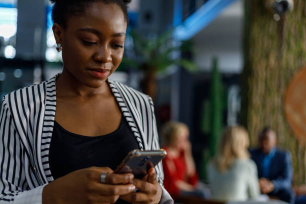 istock Happy businesswoman using smartphone in office 1427982757