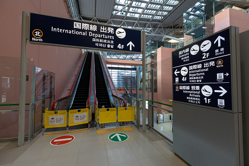 Osaka, Japan - August 14, 2022 : Closed escalators are seen at Kansai International Airport in Osaka, Japan.