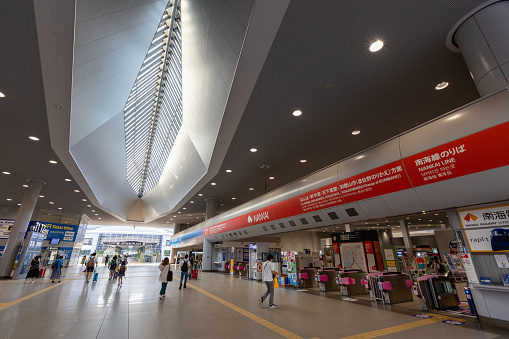 Osaka, Japan - August 14, 2022 : People at the Kansai Airport Station in Osaka, Japan. The railway station shared by Nankai Electric Railway and JR West.