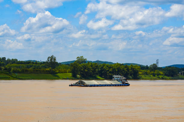 Large sand mining boat driving on the river outdoors