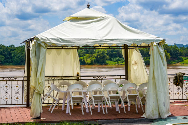 istock Dining table and chairs for outdoor riverside banquets 1427984138