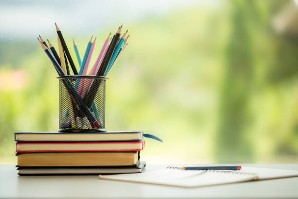 istock Object education green nature background with stack of ancient books or old bible, open paper book on wooden table with copy space. concept of back to school, research study 1427985471
