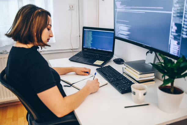 istock Girl learning to code on desktop computer at home stock photo 1427987036