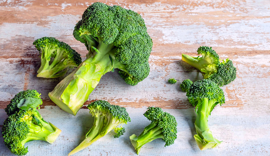 Fresh broccoli for cooking on a wooden table,healthy vegetables.top view