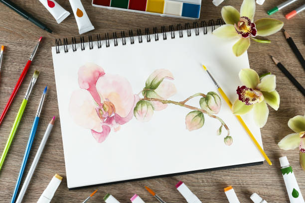 istock Flat lay composition with beautiful drawing of orchid 1427990914