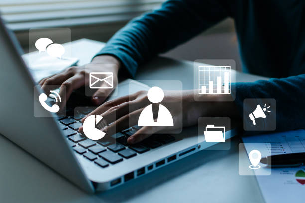 istock Business Strategy. woman hand using laptop computer and mobile smart phone with virtual graphic icon diagram on desk, digital marketing, business finance, internet network technology concept 1427998632