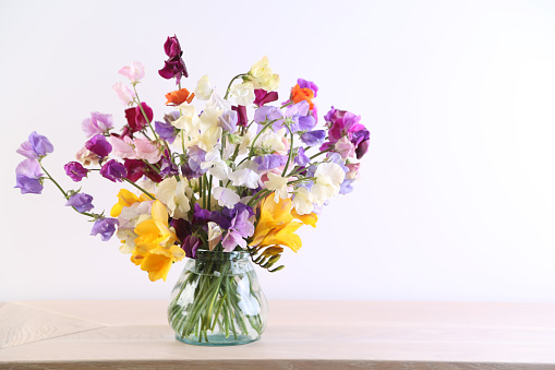 Bouquet of multicolored freesias, yellow, white, red, violet and green