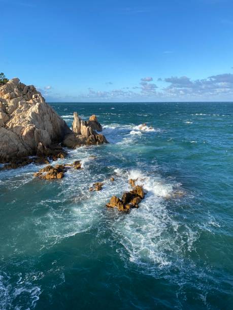 istock rocks on the blue sea in korea 1427999611