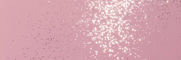 istock Sparkling silver glitter on pink background banner 1428000436