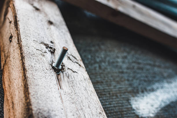Threaded rod in a wood piece. Carpentry concept for home construction