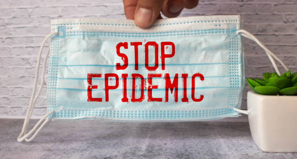 istock ampoule and a blue plate with the inscription - STOP EPIDEMIC 1428010708