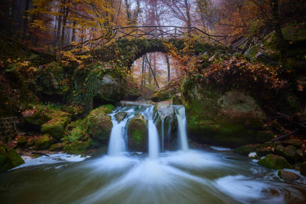 Waterfall in the Mullerthal during autumn stock photo