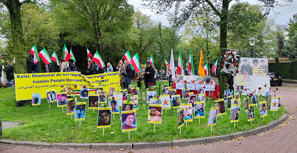 The Hague, Netherlands - September 27, 2022: Demonstration at the Iranian embassy. Images are shown of people from Iran who, according to the protesters, were murdered by the Iranian government.