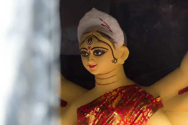 Close up of an incomplete idol of Hindu Goddess Durga portrait  in a workshop in Kolkata, West Bengal, India.