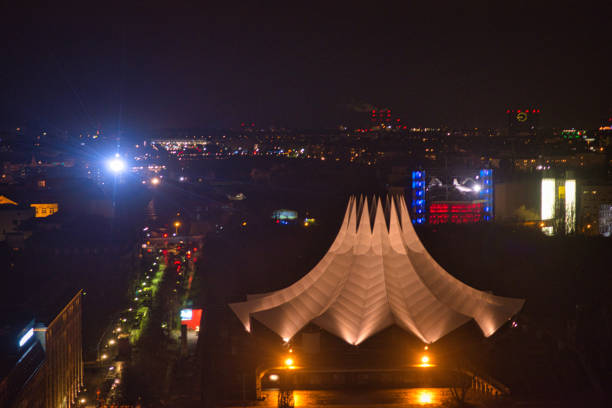 Night view of Berlin with the Tempodrom. In December it gets dark early and creates wonderful views of the city. In the left side of the picture you can see Möckernstraße. The lights of the city paint a colorful picture. Some buildings are brightly lit.