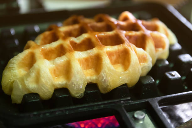 istock Croffle; Croissant+Waffle on cast iron waffle on a stovetop. 1428022795