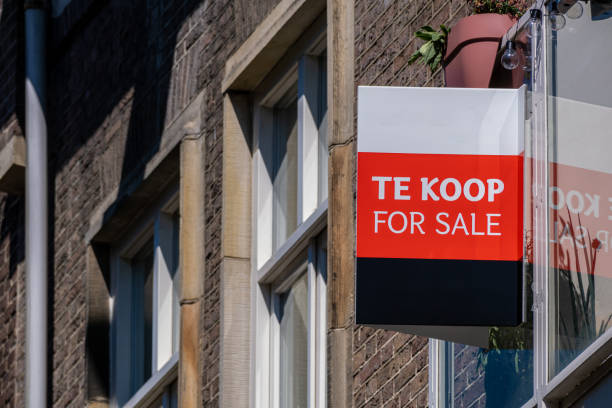 Te Koop (For Sale in Dutch) on the facade of a building stock photo