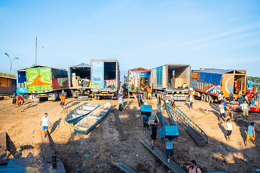 yurimaguas, peru.12th september, 2022: workers at yurimaguas port loading cargo ships to iquitos