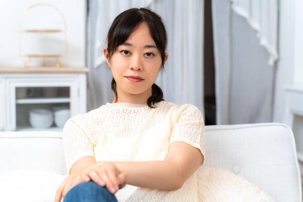 istock Young woman relaxing on sofa at home 1428025749