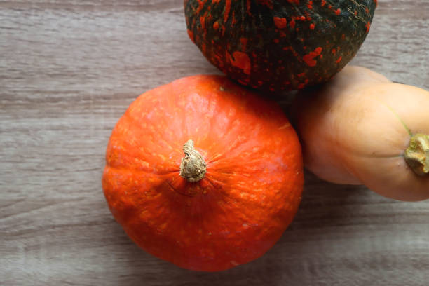 istock Pumpkins on Wooden Table 1428026970