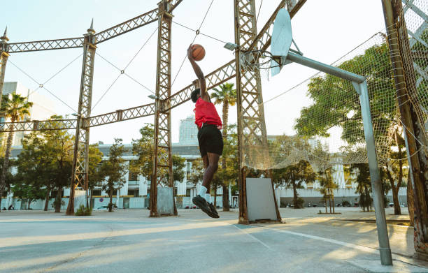 istock Young basketball player training at the court 1428034813