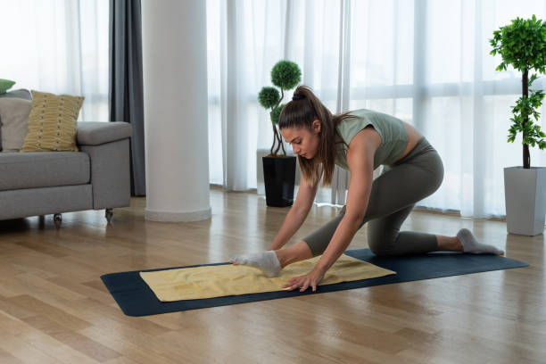 istock Young woman cancer survivor practicing home workout yoga training, stretching muscles and breathing exercise for healthy life after long struggle with sickness and pain. 1428036714