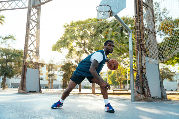 istock Young basketball player training at the court 1428037240