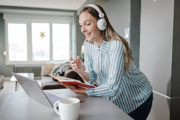 istock Woman works on a laptop at home and concentrates on work 1428039446