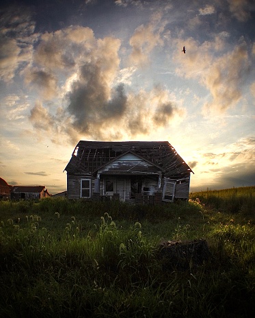 Abandoned house at sunset