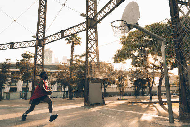 istock Young basketball player training at the court 1428043839