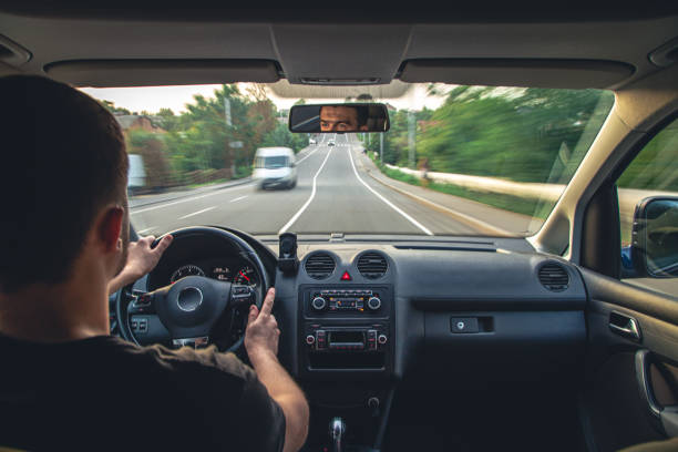 istock Hands on the wheel when driving at high speed from inside the car. 1428048641