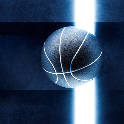Top down view of basketball ball and light glow line on dark field background. Abstract theme of neon sport equipment. Moody design concept idea.